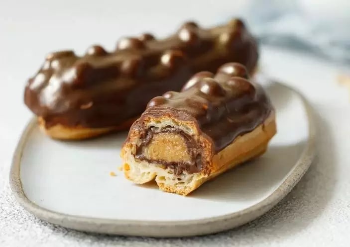 Эклер Сникерс 65гр, 5шт/упак, 6упак/кор Десертные Истории НФ-152 купить в Донецке - СтриПсБери